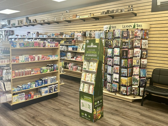 The remodeled pharmacy sales floor with maple shelving